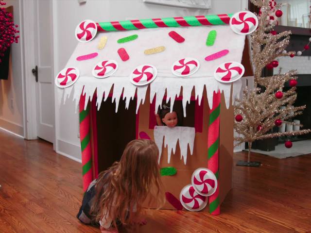Step-by-step photo instructions for making a Christmas decor - a cardboard  house, step 3 - painting the roof with a brush Stock Photo - Alamy